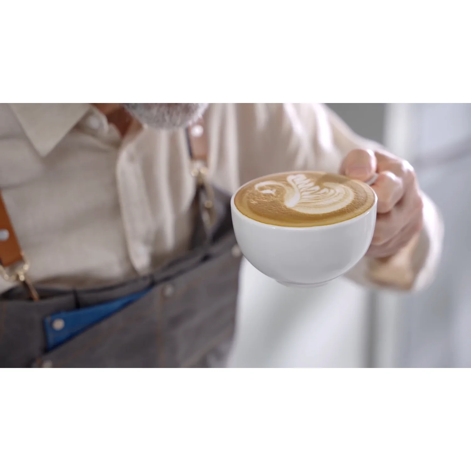 A flat white poured on the compact Neretva espresso machine